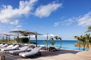 Outdoor pool, pool umbrellas, sun loungers