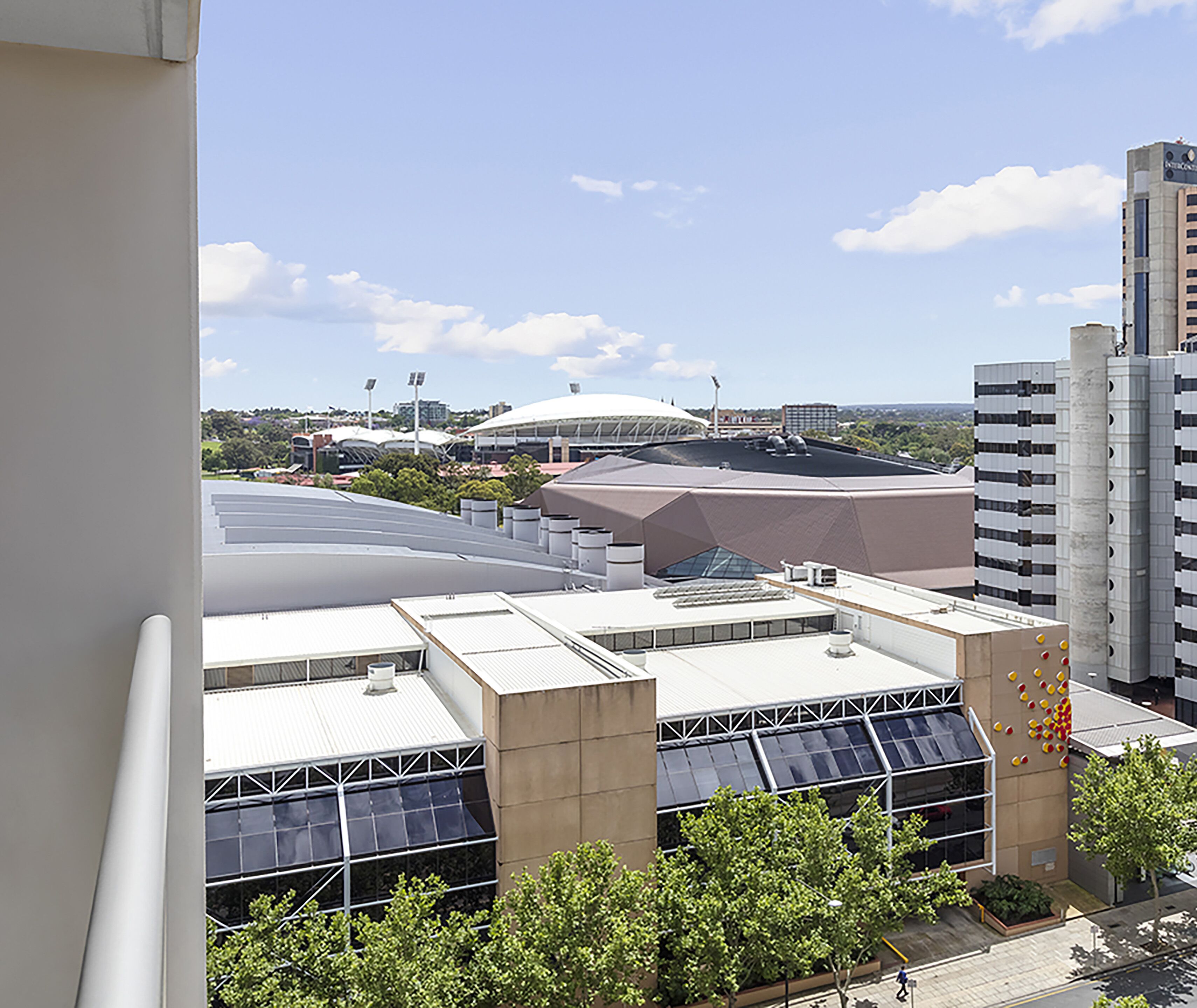 A high-rise building with a modern architectural design, featuring large windows and a flat roof.