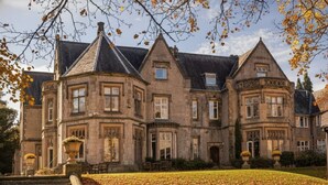 A large, historic stone building with multiple gabled roofs and a symmetrical facade. - Mercure Sheffield Kenwood Hall & Spa (Sheffield)