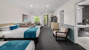 A hotel room with two beds, a sofa, a TV, a desk, and a bathroom. - Best Western Plus Apollo Hotel Newcastle (Charlestown)