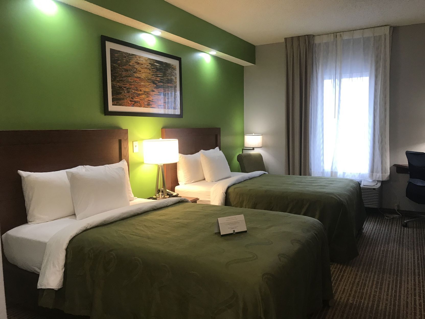 Premium bedding, pillowtop beds, desk, laptop workspace