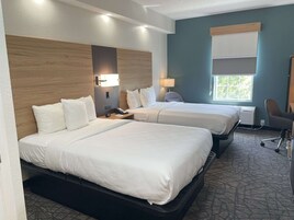 Premium bedding, pillow-top beds, desk, laptop workspace