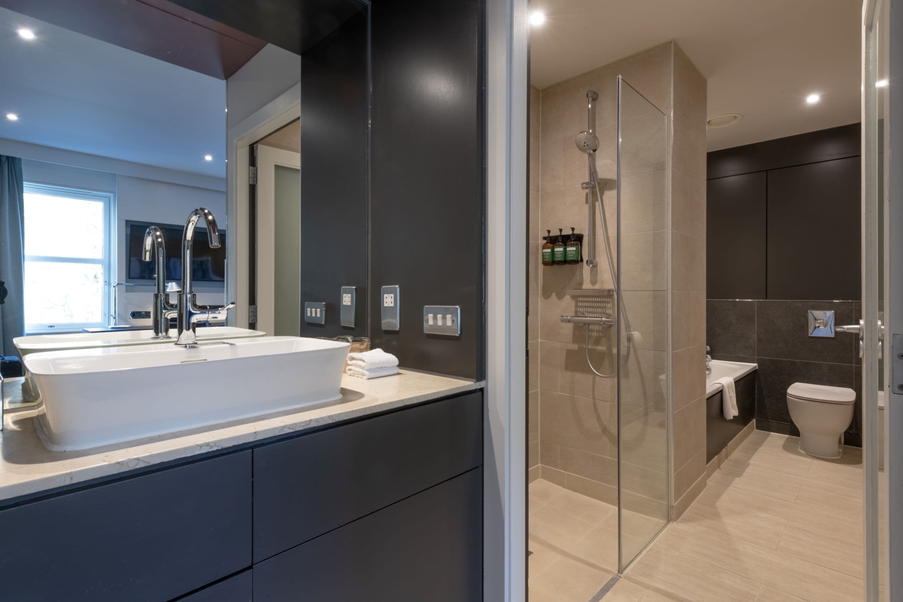 castle view suite | bathroom | designer toiletries, hair dryer, towels