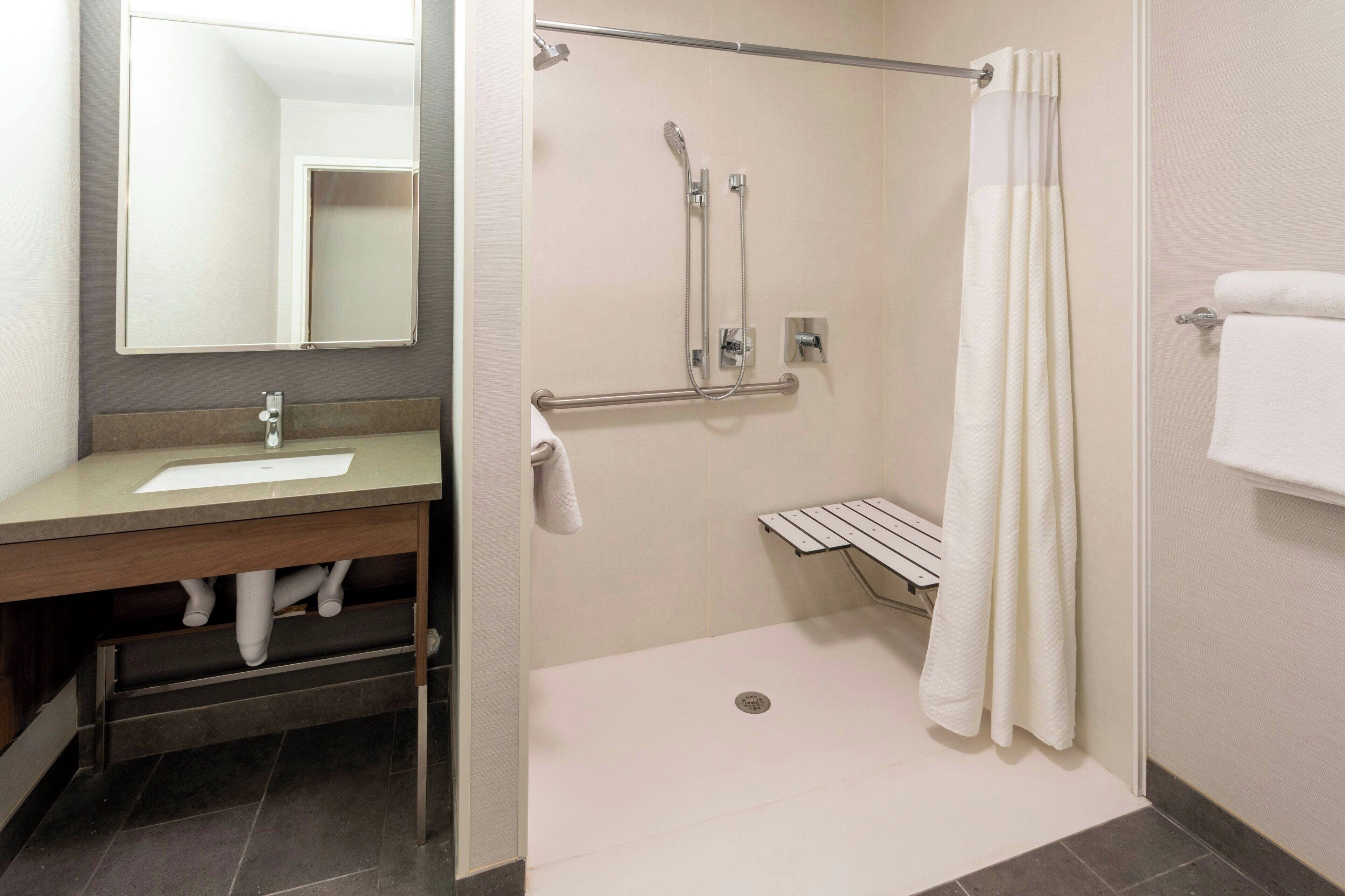 designer toiletries, hair dryer, towels, soap