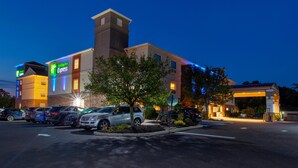 A Holiday Inn Express hotel with a parking lot and a gas station. - Holiday Inn Express & Suites Absecon-Atlantic City by IHG (Absecon)