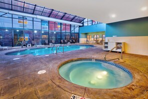 An indoor swimming pool with a hot tub, lounge chairs, and a reception area. - Holiday Inn Express & Suites Absecon-Atlantic City by IHG (Absecon)