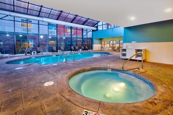 Indoor pool, open 9:00 AM to 9:00 PM, pool loungers