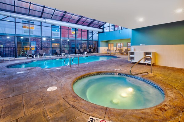 Indoor pool, open 9:00 AM to 9:00 PM, pool loungers