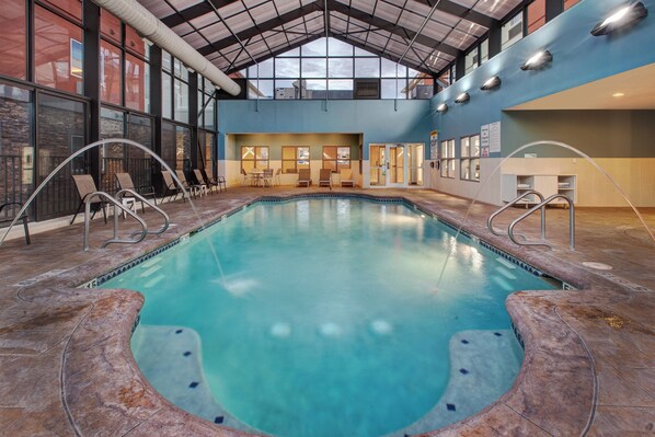 Indoor pool, open 9:00 AM to 9:00 PM, pool loungers