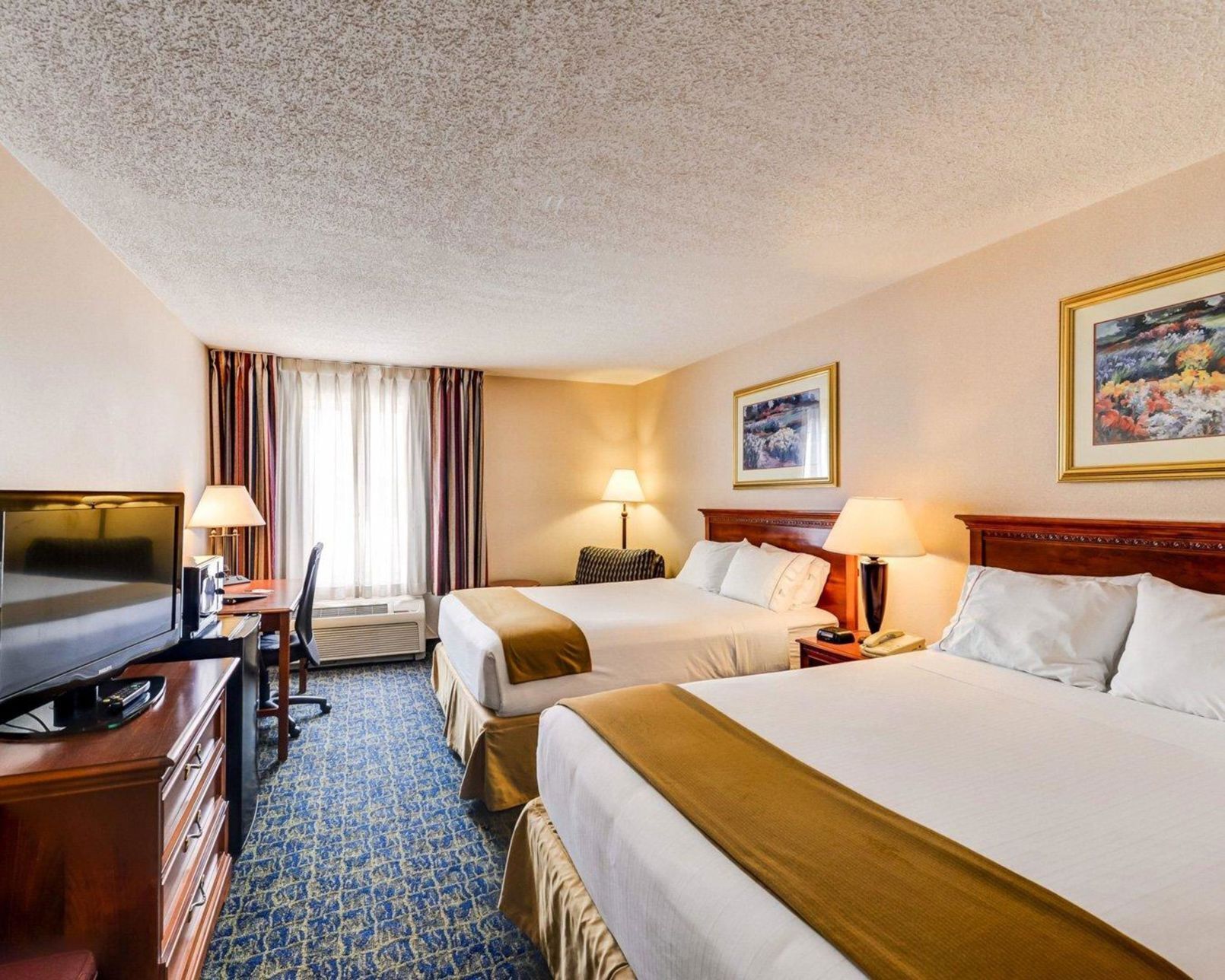 Premium bedding, pillow-top beds, desk, blackout curtains
