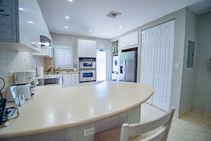 Family Condo, 2 Bedrooms | Private kitchen | Fridge, microwave, oven, stovetop - Seven Mile Beach Resort & Club (Seven Mile Beach)