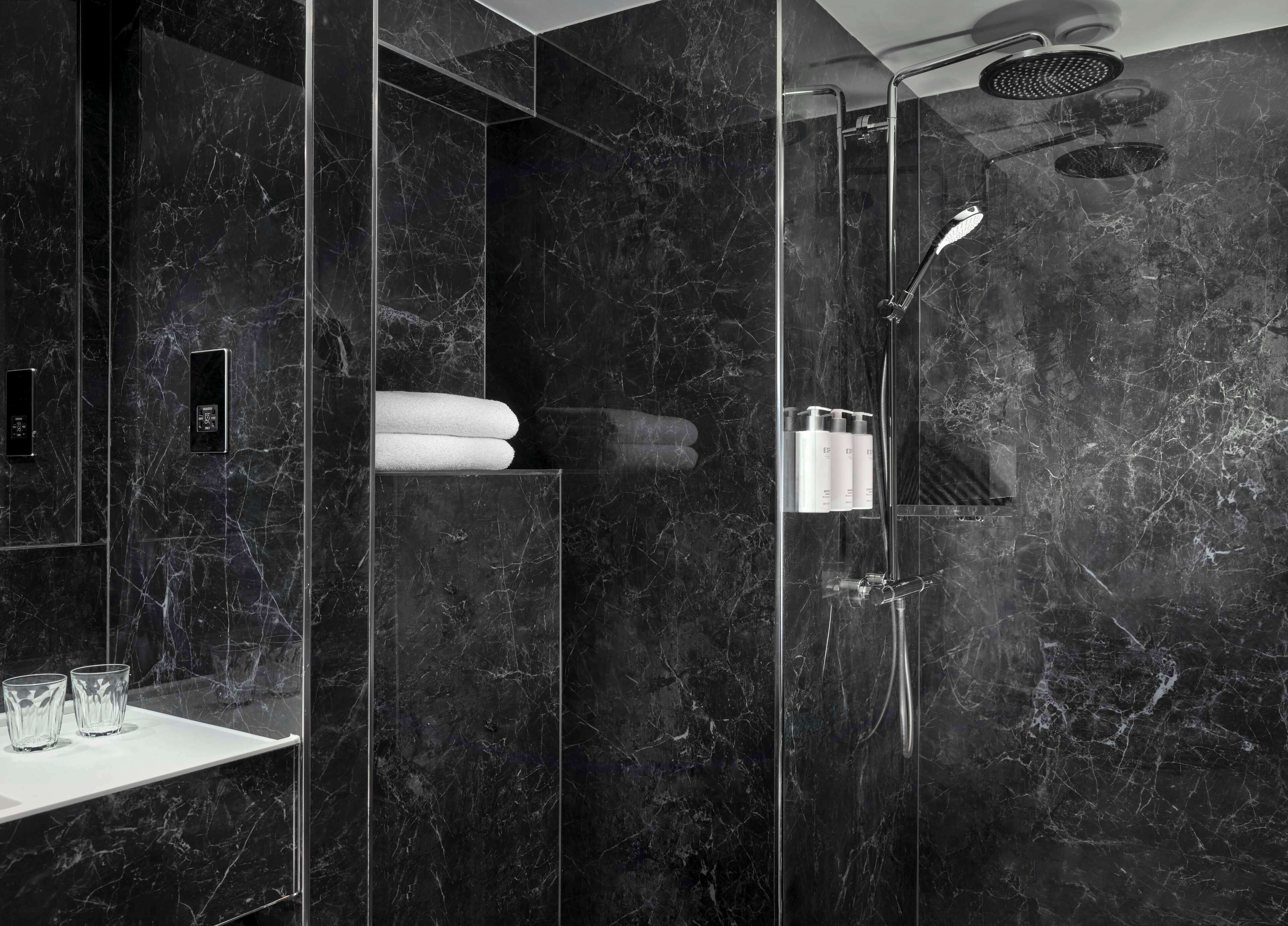 combined shower/bathtub, designer toiletries, hair dryer, towels