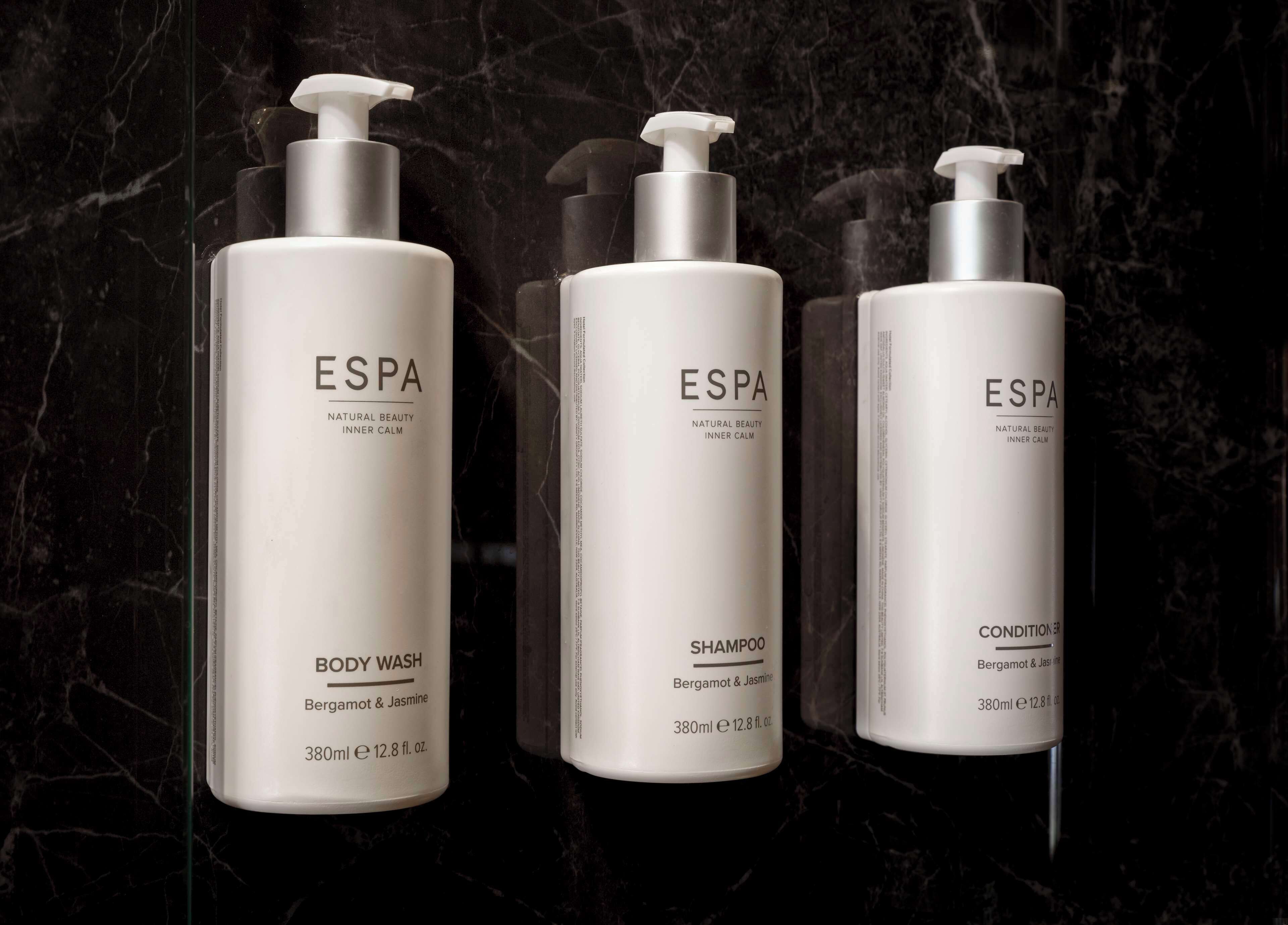 combined shower/bathtub, designer toiletries, hair dryer, towels