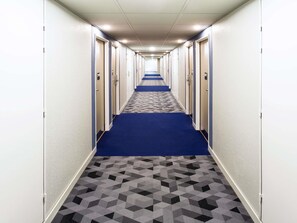 Desk, soundproofing, iron/ironing board, free cribs/infant beds