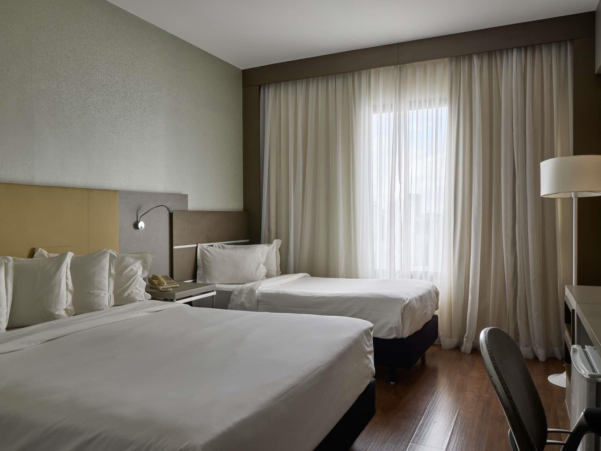 Superior Room, Multiple Beds | Minibar, in-room safe, laptop workspace, blackout curtains