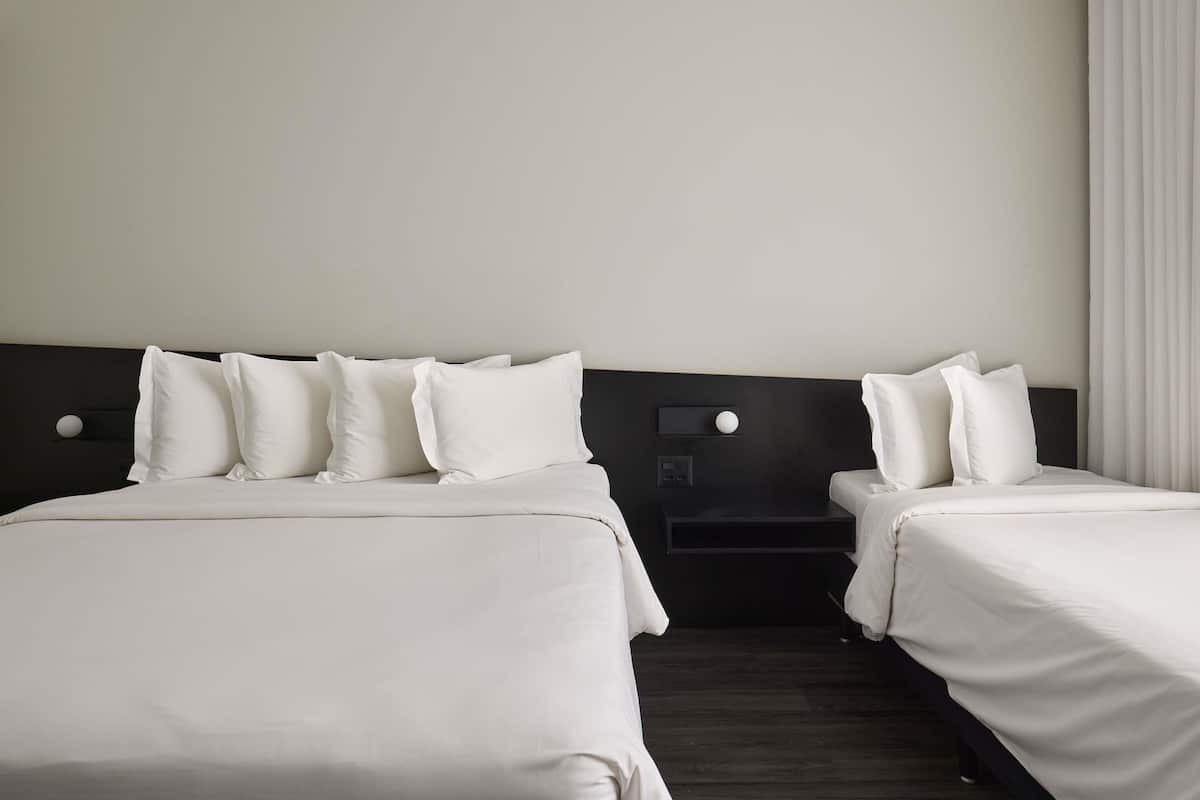 Standard Room, Multiple Beds | Minibar, in-room safe, desk, blackout drapes