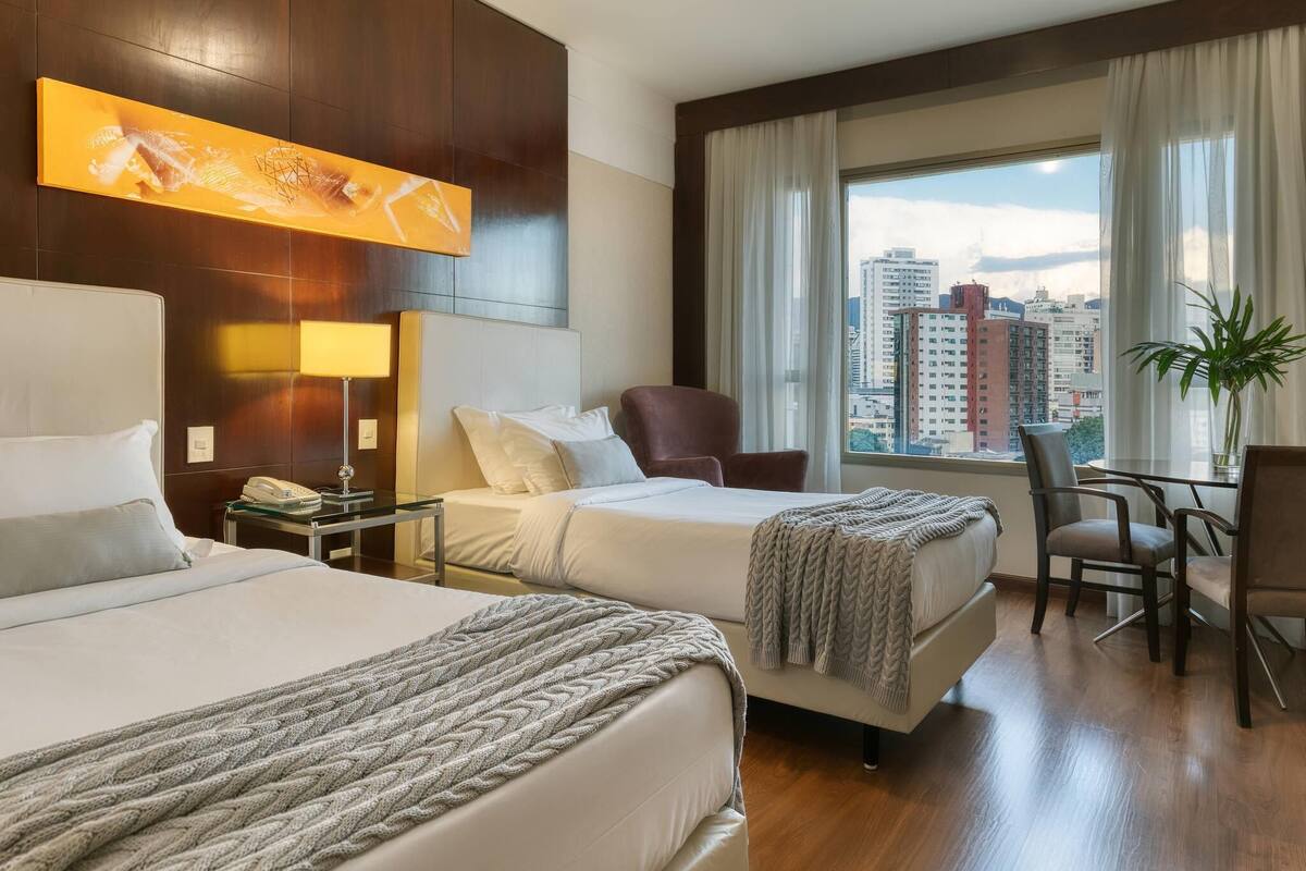 Classic Room, Multiple Beds | Minibar, in-room safe, desk, blackout curtains