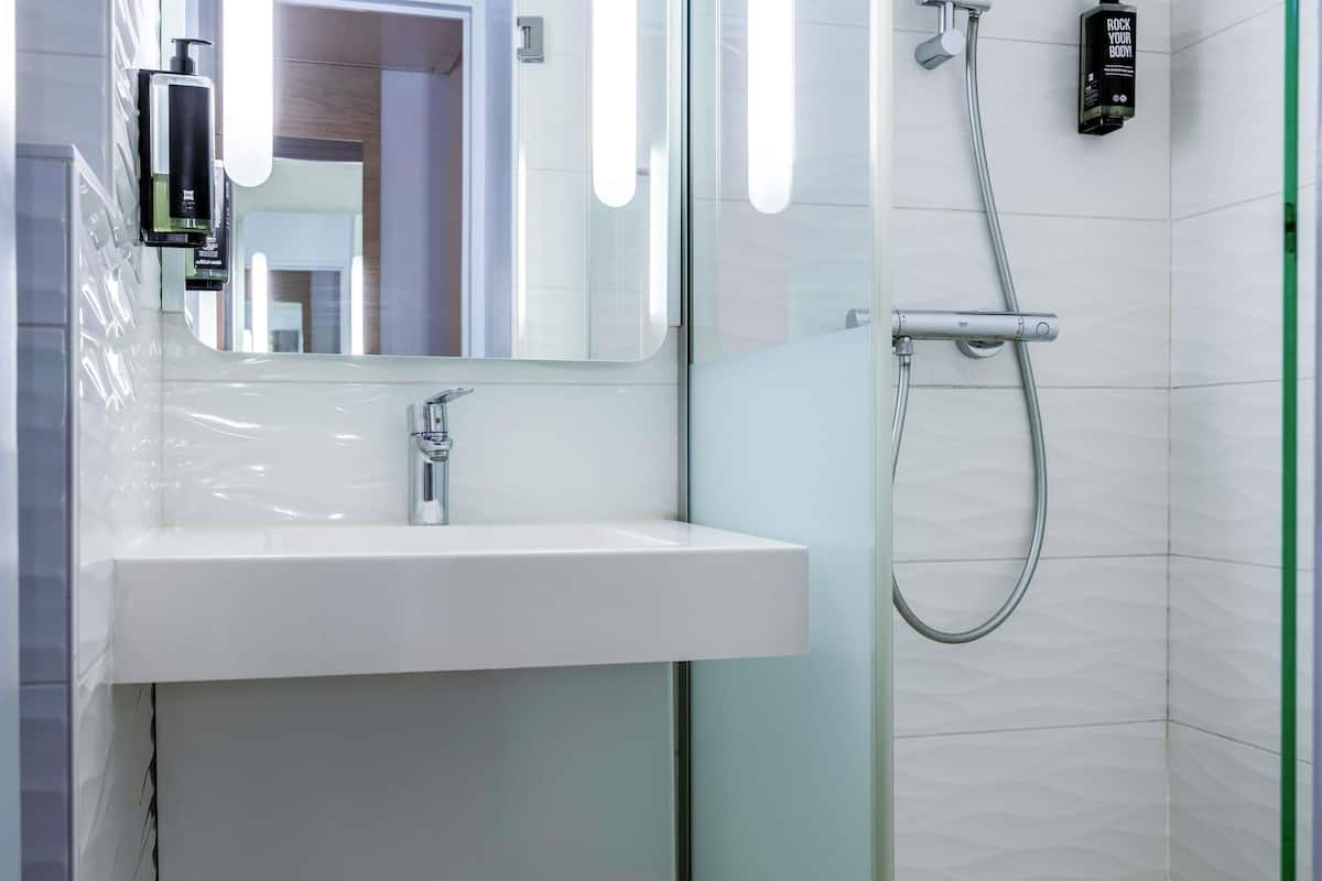 Premium bedding, blackout curtains, soundproofing, iron/ironing board