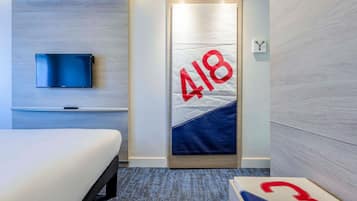 Premium bedding, blackout curtains, soundproofing, iron/ironing board