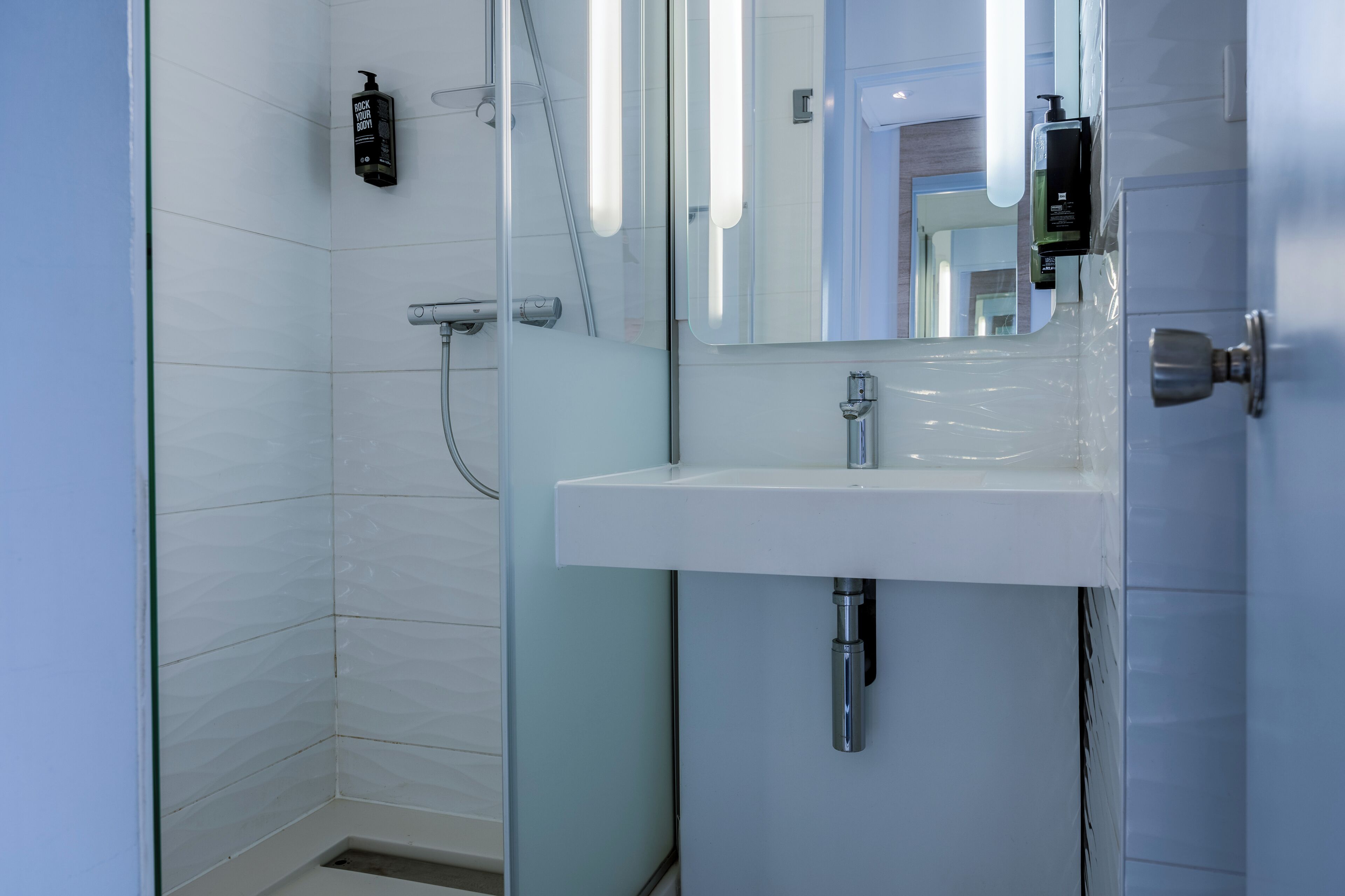 Shower, eco-friendly toiletries, hair dryer, towels