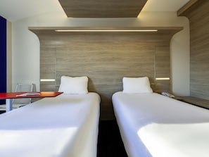 Premium bedding, blackout drapes, soundproofing, iron/ironing board