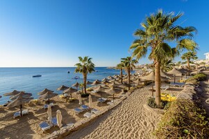 Private beach, beach towels, beach massages, beach bar