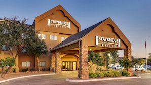A Staybridge Suites hotel with a prominent entrance, a covered walkway, and a parking lot. - Staybridge Suites San Angelo by IHG (San Angelo)