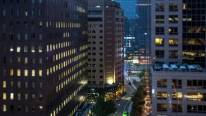 A high-rise building with multiple floors, large windows, and a central entrance area. - New Seoul Hotel (Seoul)