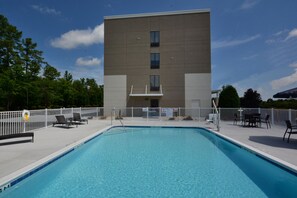 Seasonal outdoor pool, open 8:00 AM to 9:00 PM, pool umbrellas