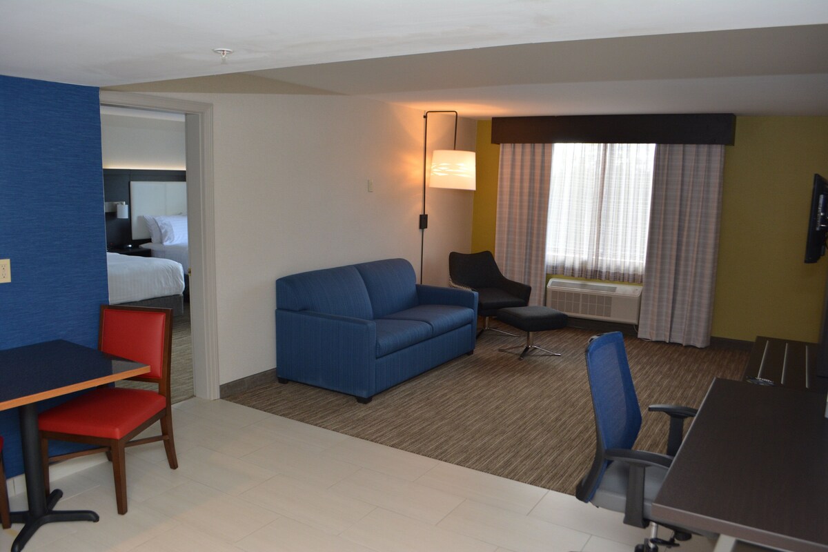 Desk, iron/ironing board, cribs (free), WiFi (free)