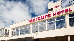 A building with the sign "Mercure Hotel" indicating a hotel establishment.