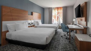 A hotel room with two beds, a desk, a chair, a TV, and a window with curtains. - Fairfield Inn & Suites by Marriott Oakland Hayward (Hayward)