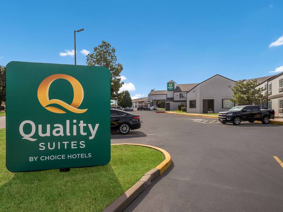 A sign for Quality Suites by Choice Hotels.
