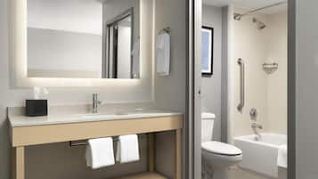 Combined shower/bathtub, designer toiletries, hair dryer, towels
