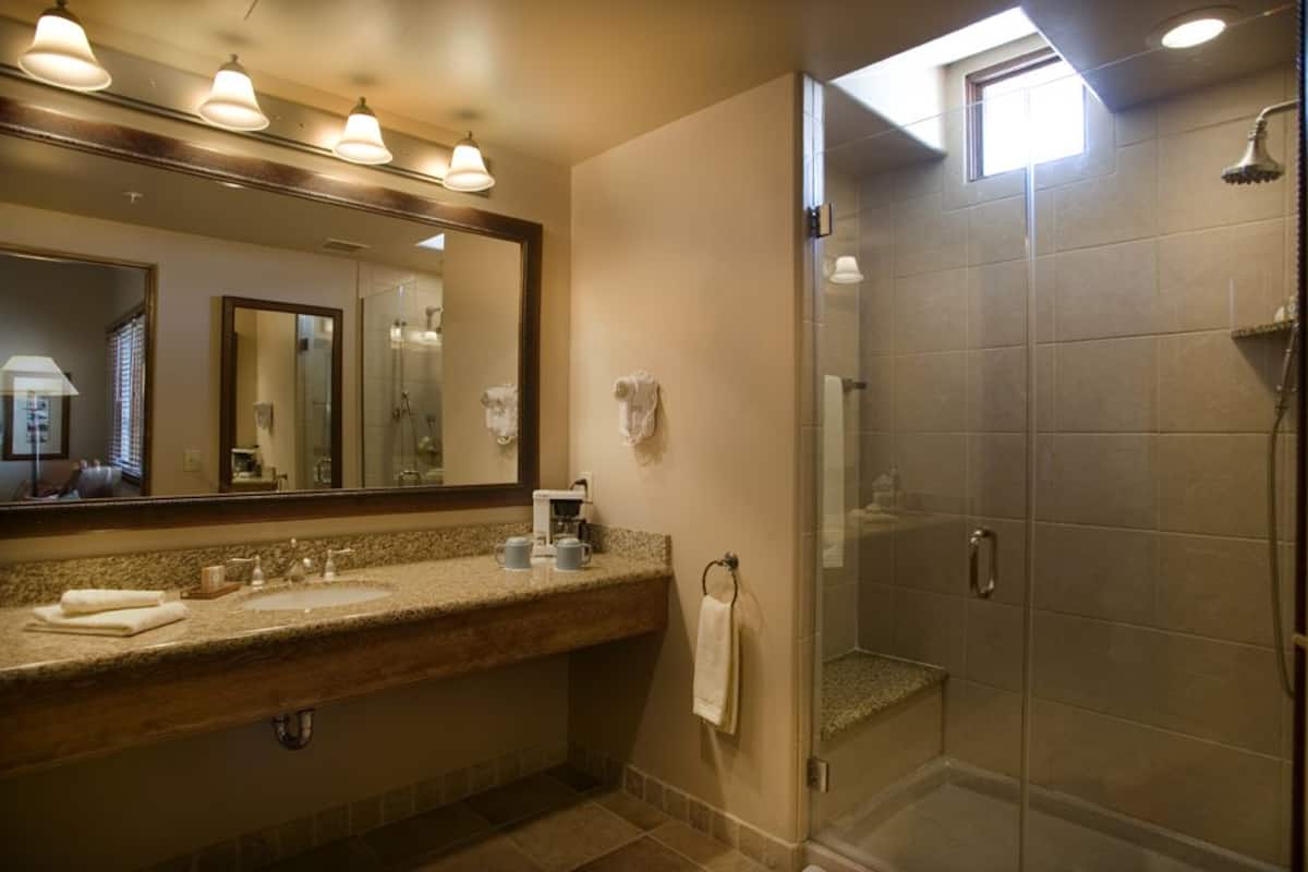 designer toiletries, hair dryer, bathrobes, slippers