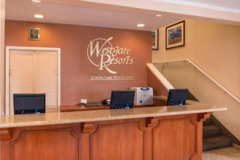 A gym with a treadmill, weight machines, and a bench. at Westgate Flamingo Bay Resort
