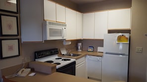 Fridge, microwave, cookware/dishes/utensils