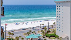 A hotel with a view of the beach and ocean. - Surfside Resort (Miramar Beach)