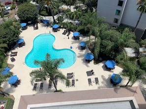 Outdoor pool, open 7:00 AM to 10:00 PM, pool umbrellas, sun loungers
