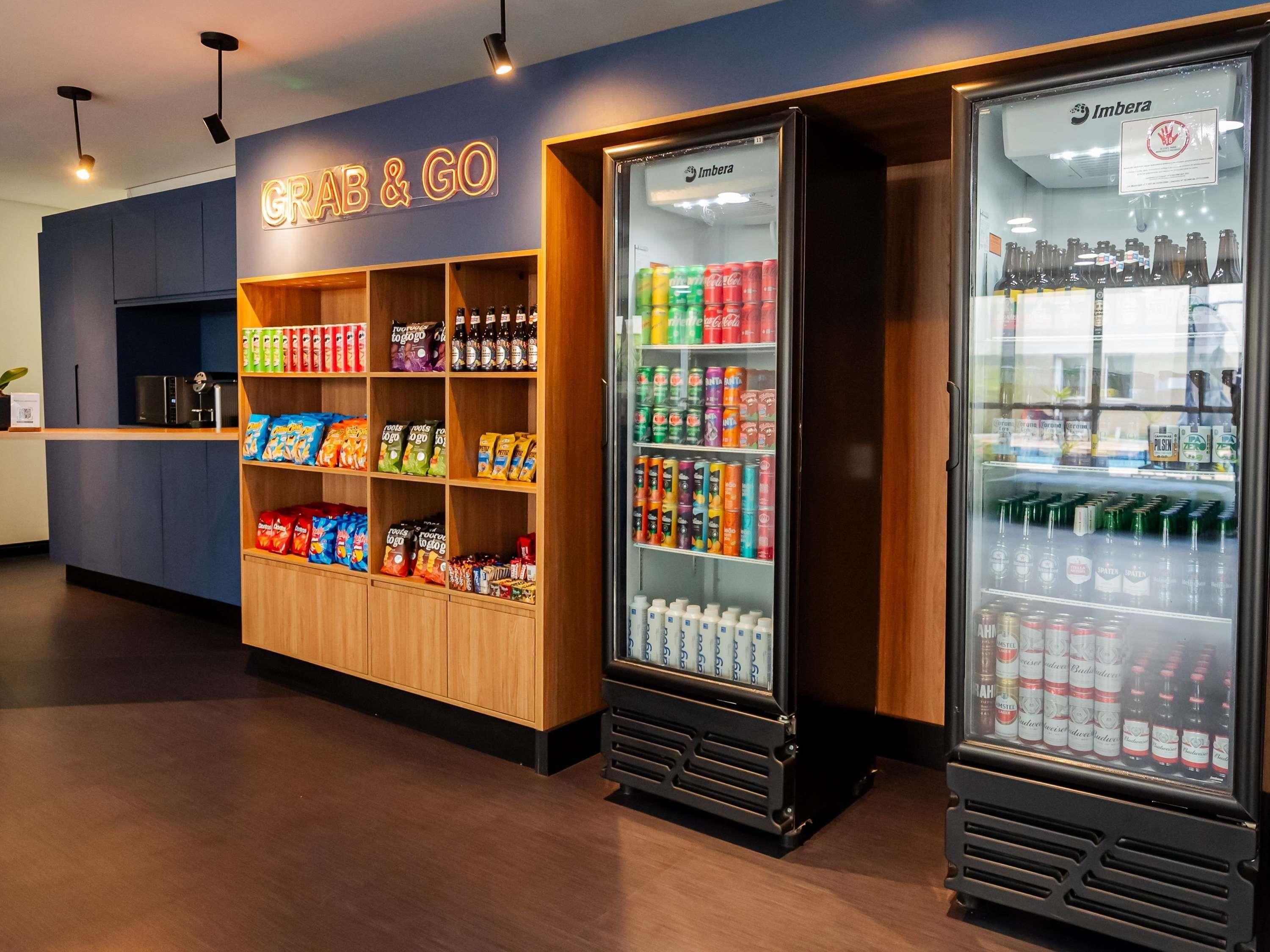 A snack bar with shelves stocked with chips, snacks, and beverages.