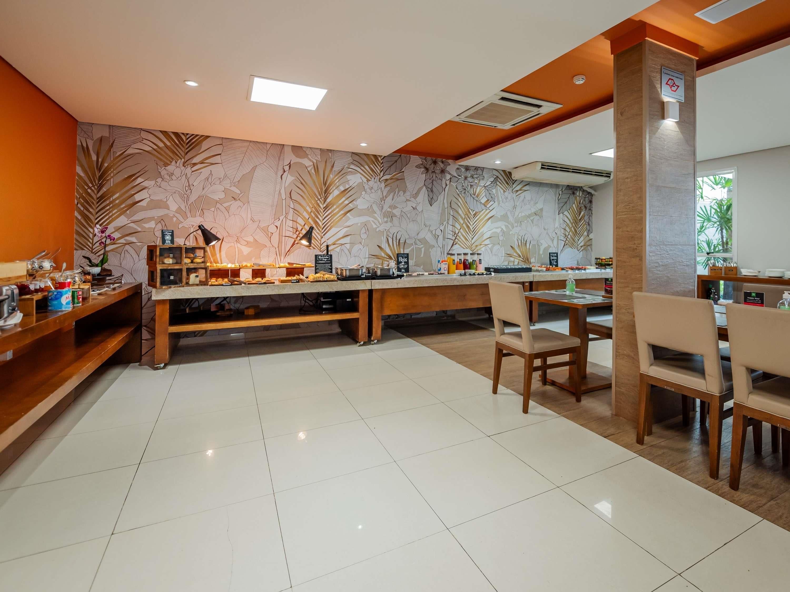 A cafe with a counter, chairs, and a tiled floor.