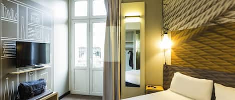 Premium bedding, pillow-top beds, desk, laptop workspace