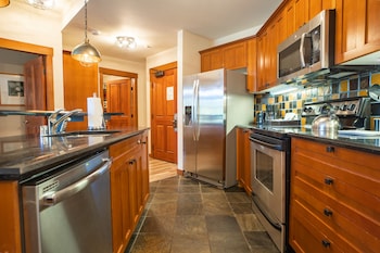 Premier Condo, One Bedroom with Den | Private kitchen | Coffee/tea maker, highchair at The Village at Palisades Tahoe