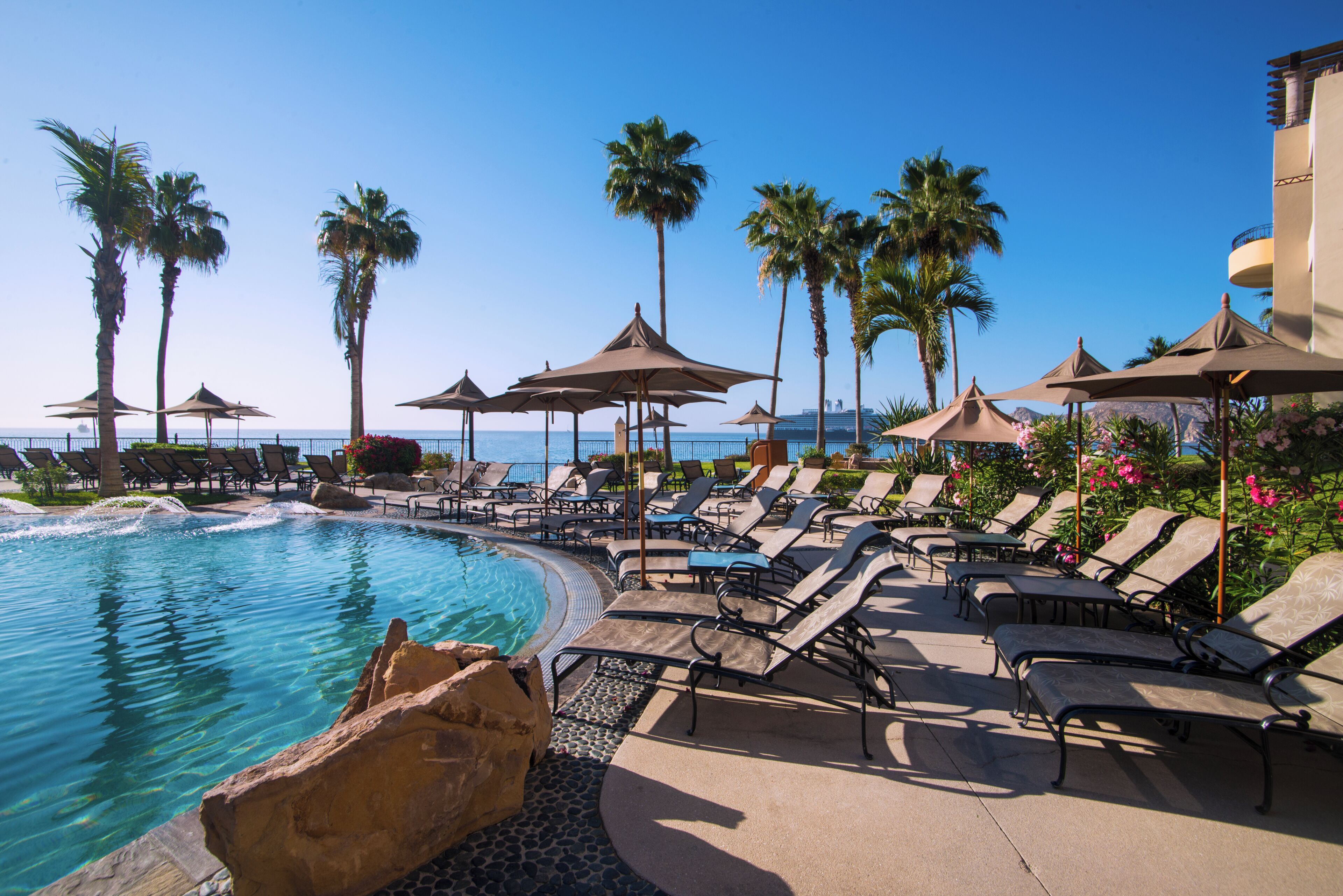 2 outdoor pools, pool umbrellas, pool loungers