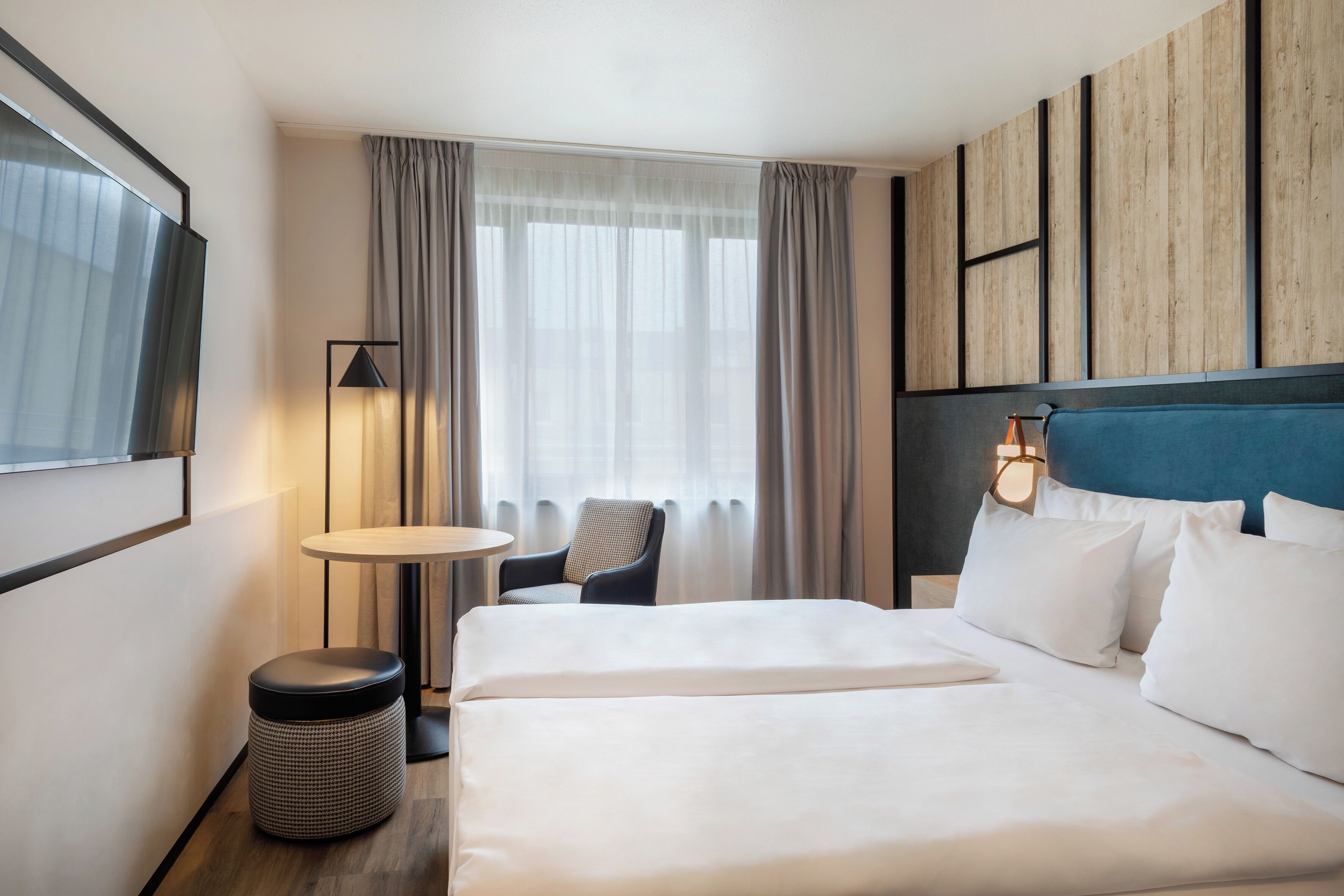 Habitación Deluxe | Ropa de cama hipoalergénica y caja de seguridad en la habitación 