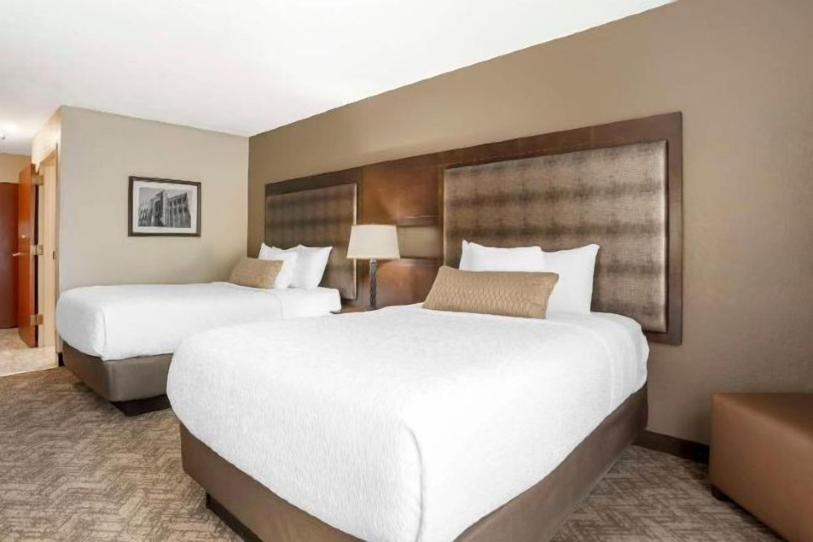 Down duvets, pillow-top beds, in-room safe, desk