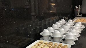 A buffet table with various desserts and white cups. - Hunts Hotel Liverpool (Casula)