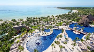 On the beach, white sand, sun-loungers, beach towels
