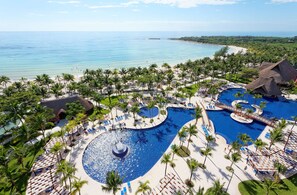 On the beach, white sand, sun loungers, beach towels