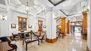 A spacious lobby with high ceilings, ornate columns, and a grand staircase leading to upper floors. - Castlereagh Boutique Hotel, an Ascend Collection Hotel (Sydney)